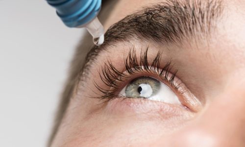 handsome-man-using-eye-drops-close-up 2